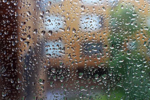 Water drops of rain on glass background