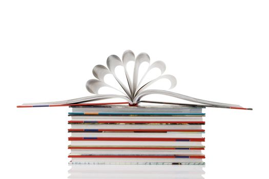 book pages folded into a flower shape on white background