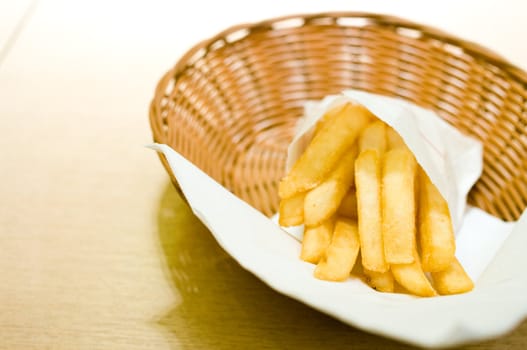 French fries in basket on the table