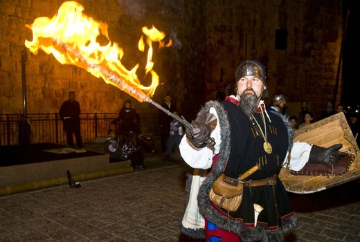 JERUSALEM - NOV 03 : An Italian actor dresses as knight fight with sword and fire in the annual medieval style knight festival held in the old city of Jerusalem on November 03 2011