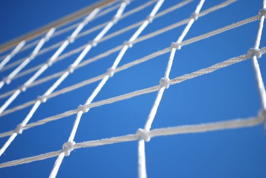 Part of Volleyball Net with Clear Blue Sky on Background