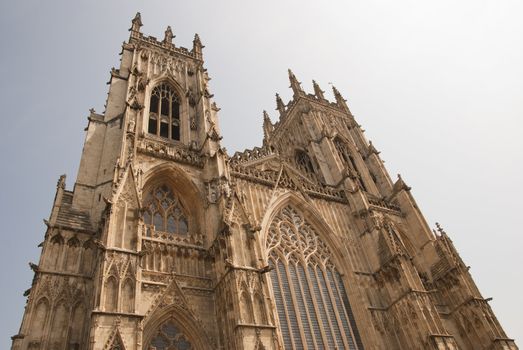 A View of the West Entrance of York Minster Yorkshire England under a blue sky