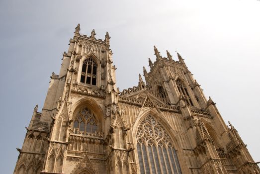 A View of the West Entrance of York Minster Yorkshire England under a blue sky