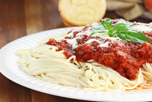 Spaghetti with tomato sauce, fresh basil and grated parmesan cheese.