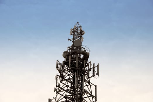 A Radio Mobile Phone Antenna against a blue sky