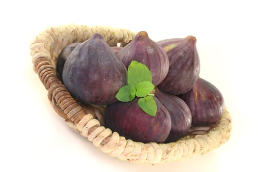 half the figs with peppermint on a basket