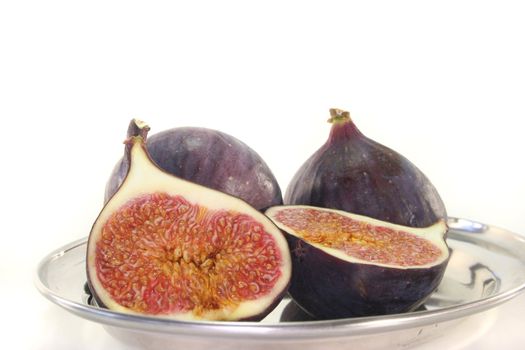 half figs with mint on a platter