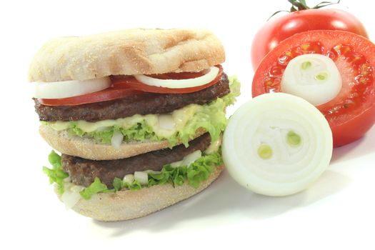 double hamburger with fresh vegetables on white background