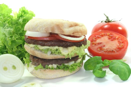 double hamburger with fresh vegetables on white background