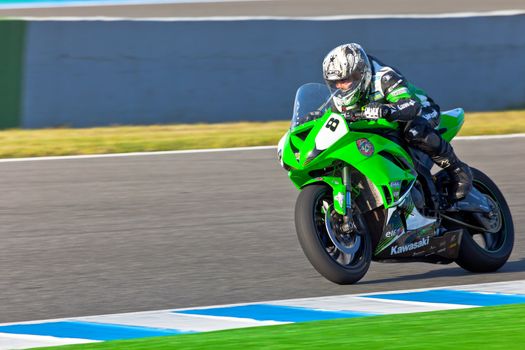 JEREZ DE LA FRONTERA, SPAIN - APR 16: Kawasaki Ninja Cup motorcyclist Adria Araujo races in the CEV Championship race on April 16, 2011 in Jerez de la Frontera, Spain.