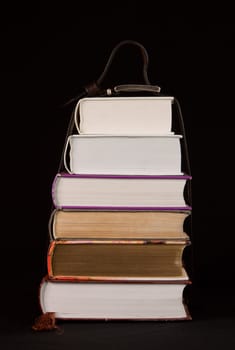 Stack of books on the black background