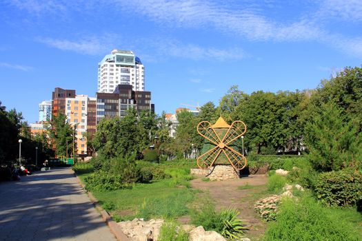 Landscape with high building and green park