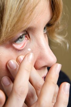 a blonde girl with contact lens