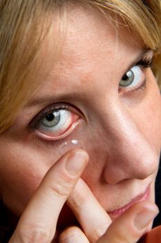 a blonde girl with contact lens