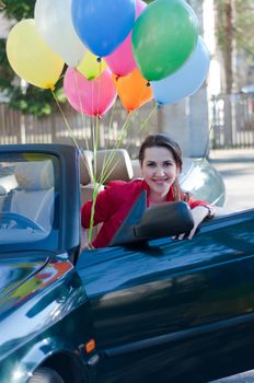 Shot of beautiful brunette woman in car