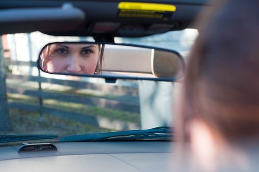 Shot of beautiful brunette woman in car