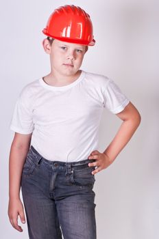 Portrait of a boy in a red protective helmet