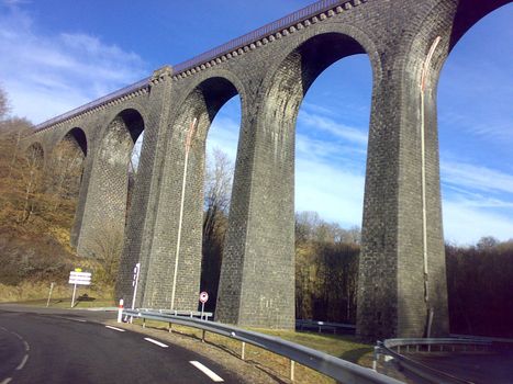 Railroad old bridge in France province in winter