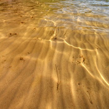 Interesting patterns in the sand seen through crystal clear Wisconsin waters.