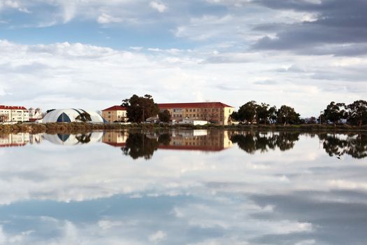Reflection of an old fishing village by the river.