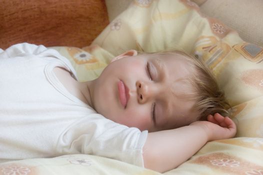 Baby sleeping on pillow in bed