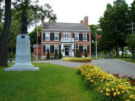 Townhall, statue, garden and flowers in Gananoque, Canada