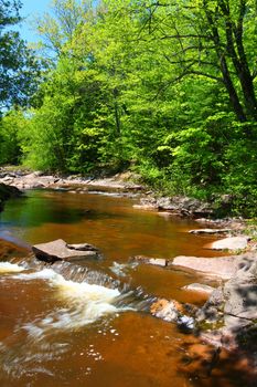 Sunny day at Nonesuch Falls in the Porcupine Mountains Wilderness State Park of Michigan.