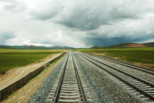 Landscape of railroads in a stormy day