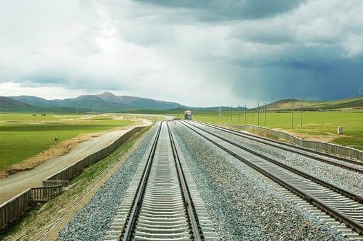 Landscape of railroads in a stormy day