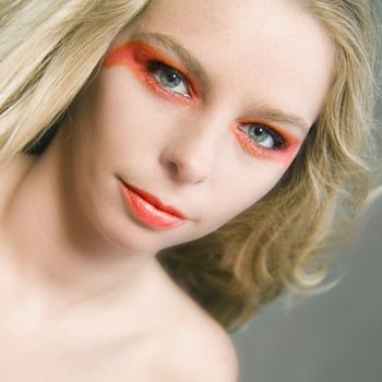 Studio portrait of a beautyfull blond model with extreme make-up