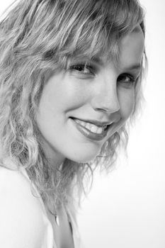 Studio portrait of a curly blond female