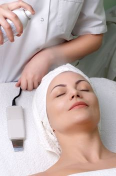 woman getting extra hydratation procedure before skin cleaning at beauty salon