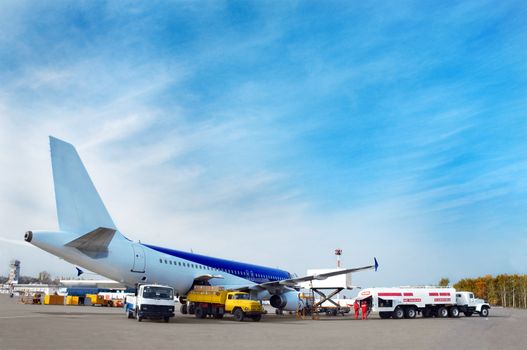 airliner's technical service at airfield, preparing for flight