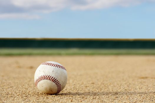 one baseball on infield of sport field