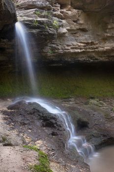 small waterfall in the forest. long exposure.