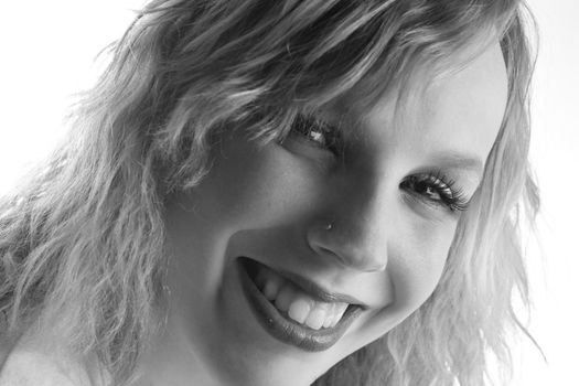 Studio portrait of a curly blond female