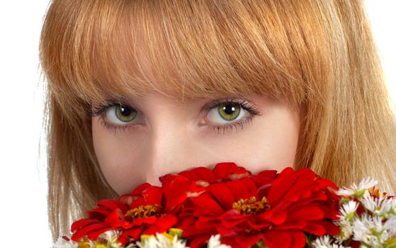 beautiful girl's green eyes and bouquet of red flowers. isolated on white.