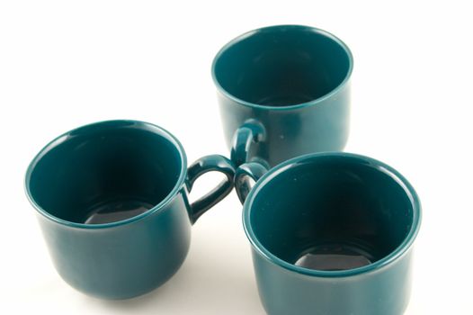 Green cups on a white background