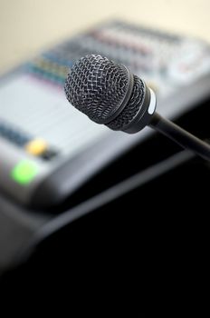 microphone at background of sound mixer. selective focus, copyspace.
