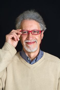 Portrait of a happy mature man isolated on black background 