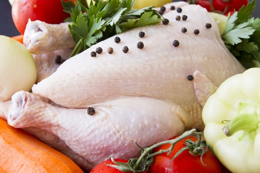 Raw chicken with pepper and vegetables ready to be prepared