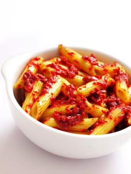 bowl of penne pasta in tomato sauce