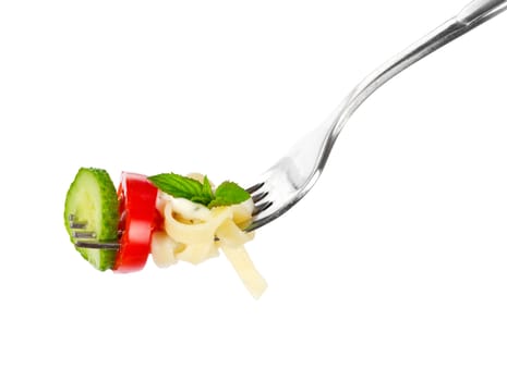 Pasta on a fork over white background