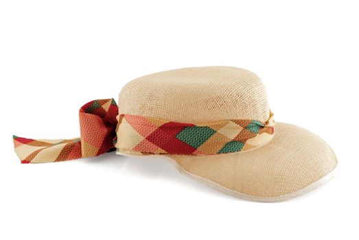 Straw hat with textile lace isolated on white background.