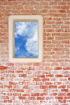 Brick wall and window to the blue sky