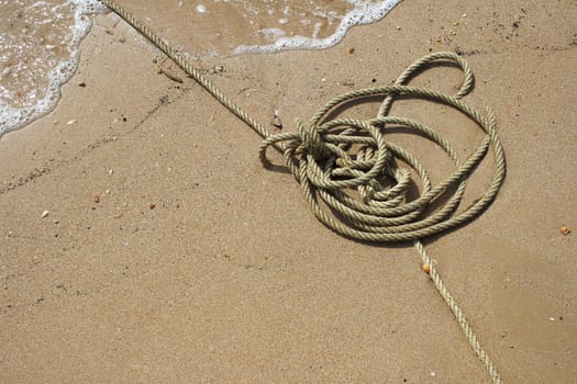 Rope on sand as background