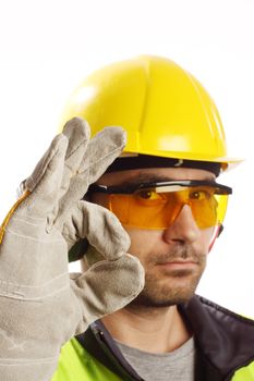 Worker with protective gear showing OK sign