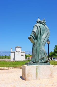 Church of the Holy Cross from 9th century and statue of bishop Gregory from Nin