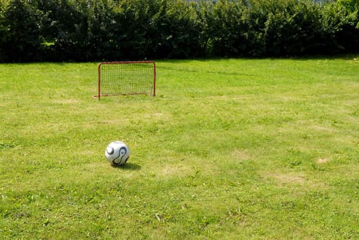 a football and goal. Please note: No negative use allowed.