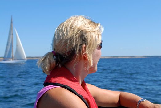 a woman looking over the sea